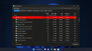 Windows Task Manager showing System Interrupts process consuming high CPU usage